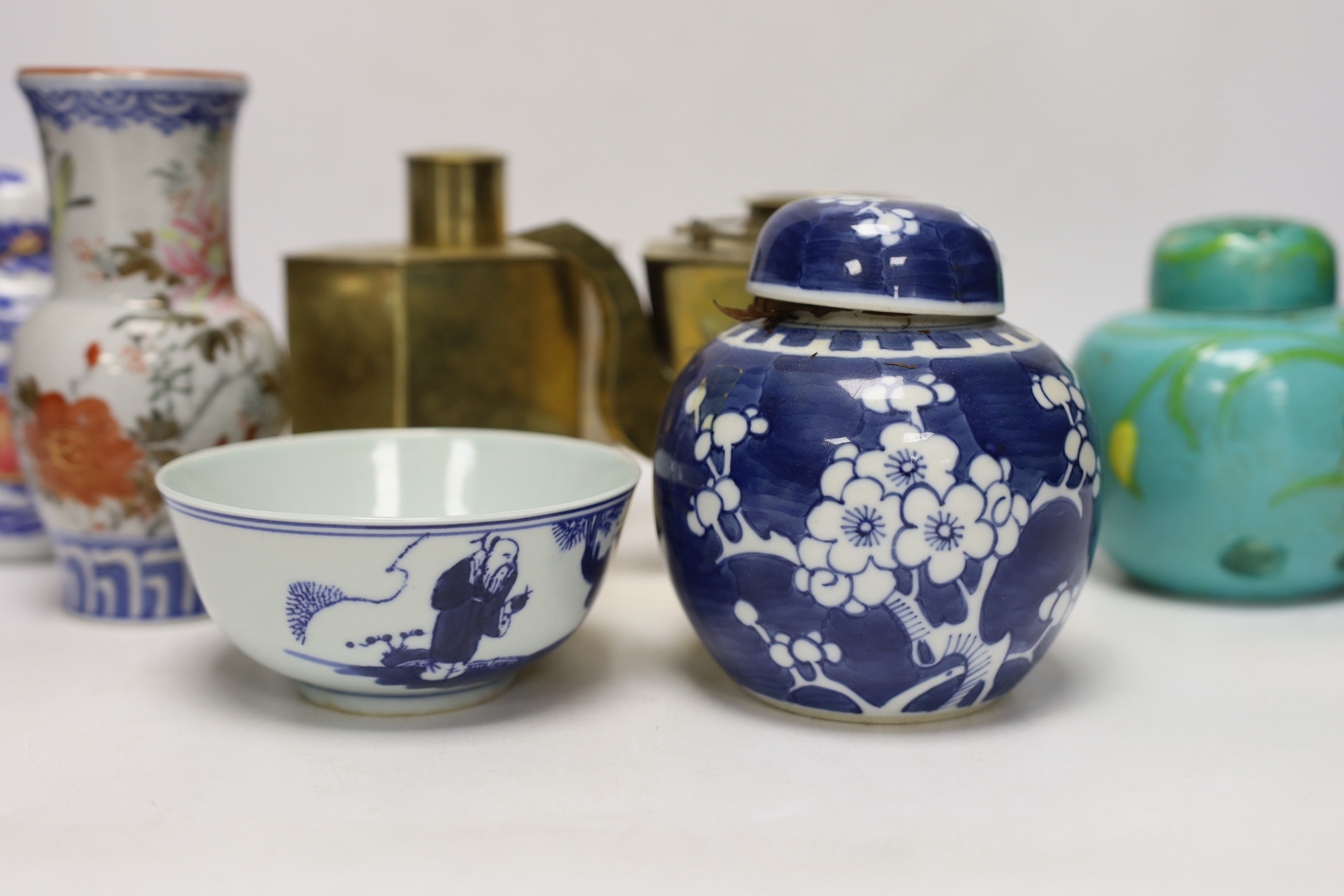 Chinese items including a brass tea caddy and kettle, blue and white porcelain bowls and a Japanese vase